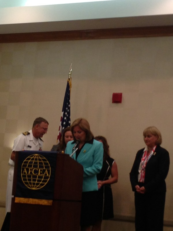 In September, Lt. Cmdr. David Pereira, USN (l), chapter vice president; Teresa Duvall (r), chapter president; and Patti Hamilton (c), Small Business Committee chairman, present the Military Cyber Professional Award to Petty Officer 1st Class Gloria Fisher, USN (2nd from l), Naval Computer and Telecommunications Area Master Station Atlantic (NCTAMS LANT), and the Civilian Cyber Professional Award to Hasene Boykins (2nd from r) of NCTAMS LANT.